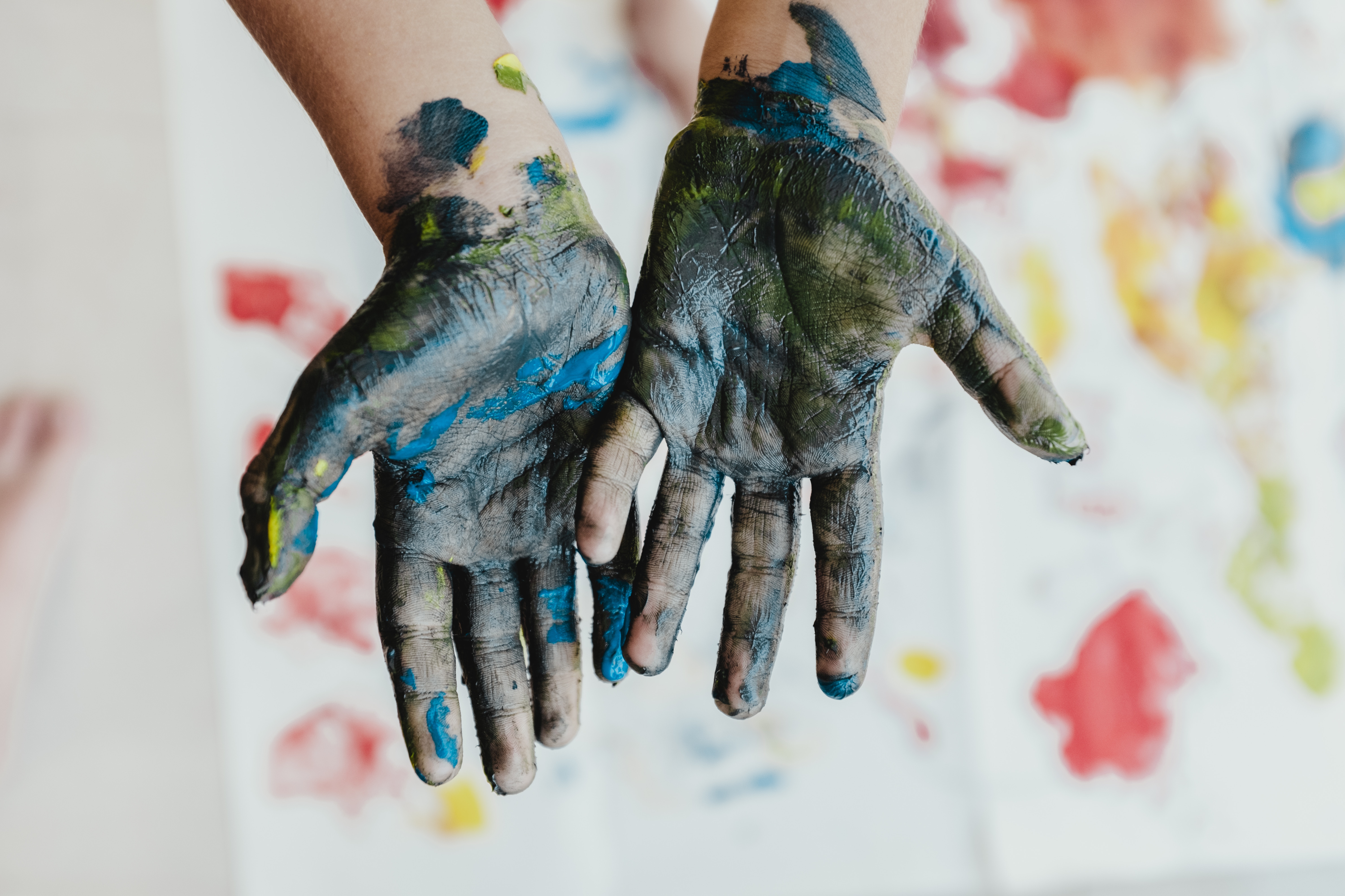 Hands Covered in Paint From Finger Painting